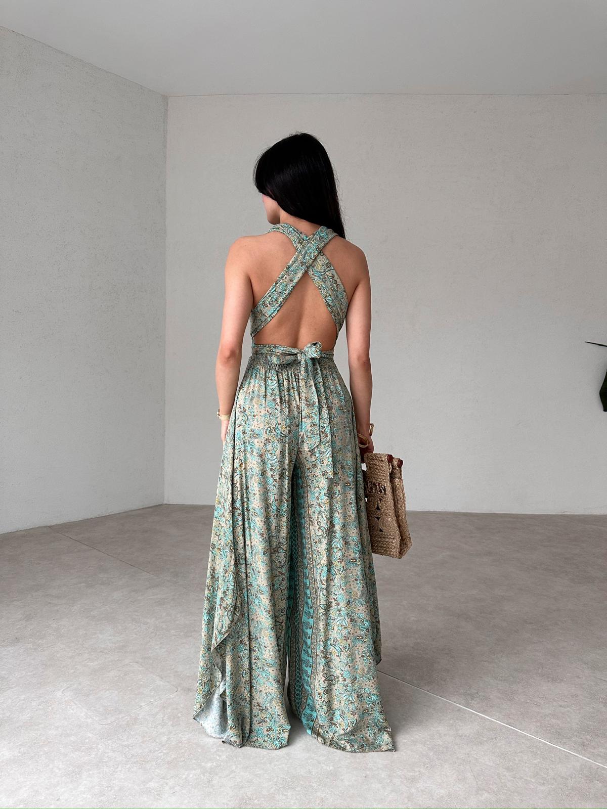 The HARPSTER Jumpsuit with Low-cut Back.